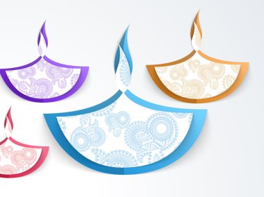 Creative lit lamps for Happy Diwali celebration.
