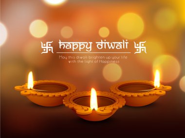 Illuminated oil lit lamps for Happy Diwali celebration.