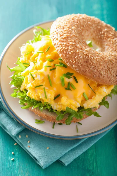 Breakfast sandwich on bagel with egg cheese lettuce — Stock Photo, Image