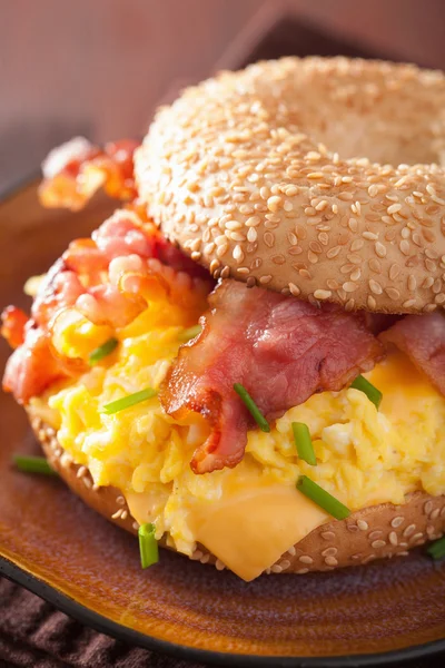 Breakfast sandwich on bagel with egg bacon cheese — Stock Photo, Image