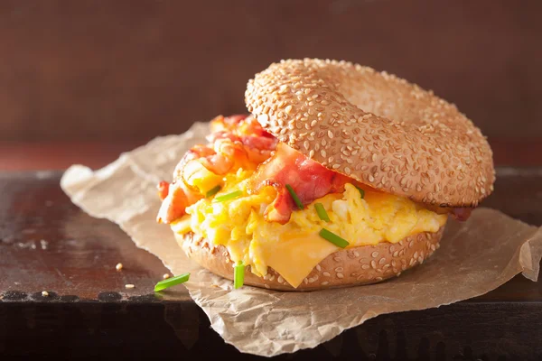 Breakfast sandwich on bagel with egg bacon cheese — Stock Photo, Image