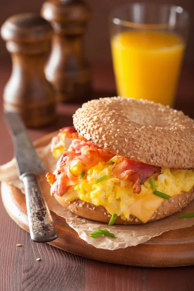 Breakfast sandwich on bagel with egg bacon cheese — Stock Photo, Image