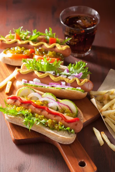 Grilled hot dogs with vegetables ketchup mustard — Stock Photo, Image