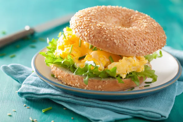 Breakfast sandwich on bagel with egg cheese lettuce — Stock Photo, Image