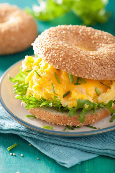breakfast sandwich on bagel with egg cheese lettuce