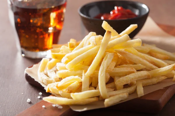 French fries with ketchup over rustic background — Stock Photo, Image