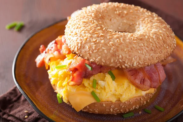 Breakfast sandwich on bagel with egg bacon cheese — Stock Photo, Image