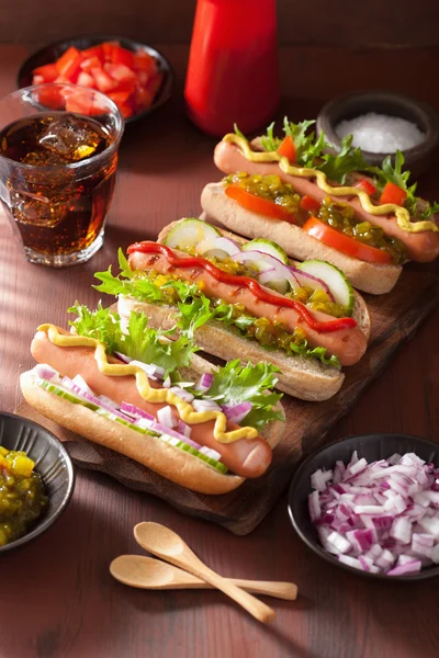 Grilled hot dogs with vegetables ketchup mustard — Stock Photo, Image