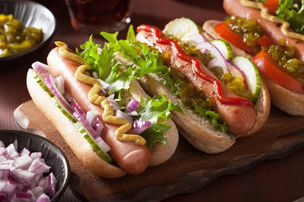 Grilled hot dogs with vegetables ketchup mustard — Stock Photo, Image