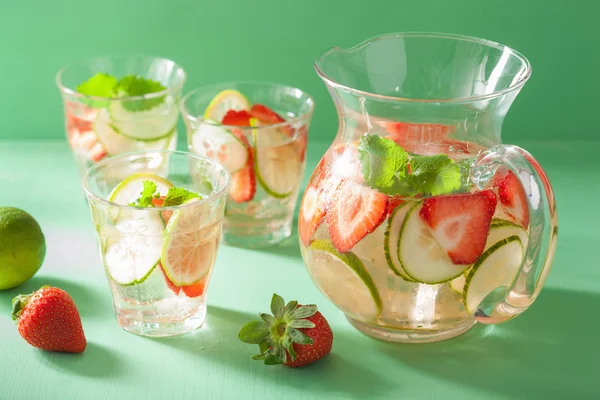 Refreshing summer drink with strawberry cucumber lime in jar and — Stock Photo, Image