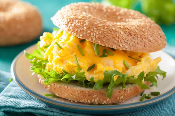 Breakfast sandwich on bagel with egg cheese lettuce — Stock Photo, Image