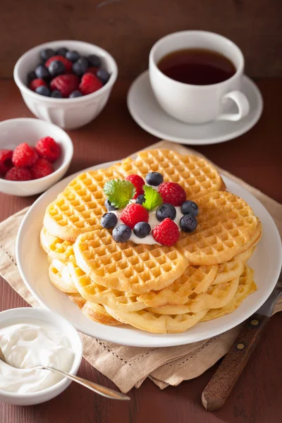 Waffles with creme fraiche and berries for breakfast — Stock Photo, Image