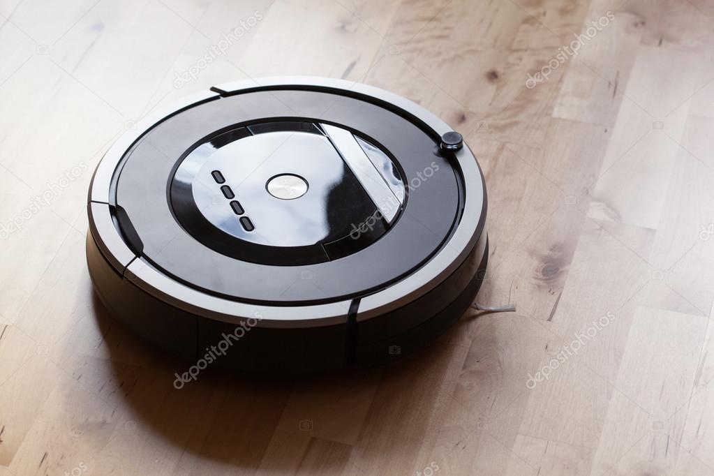 robotic vacuum cleaner on laminate wood floor smart cleaning tec