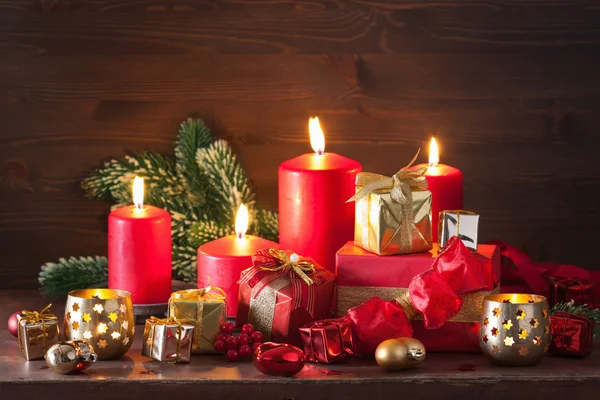 Red and golden christmas gift boxes decoration candles — Stock Photo, Image