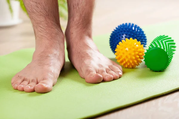 Man Doing Flatfoot Correction Gymnastic Exercise Using Massage Ball Home — Stock Photo, Image