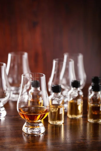 tasting bottles and glasses of whisky spirit brandy cognac. tasting at home