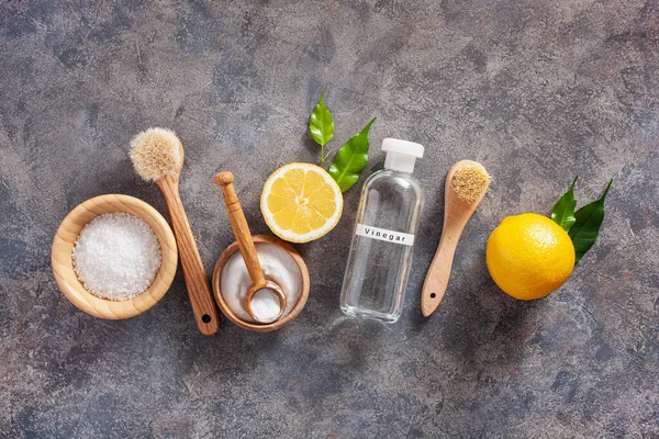 zero waste eco friendly cleaning concept. wooden brushes, lemon, baking soda, vinegar