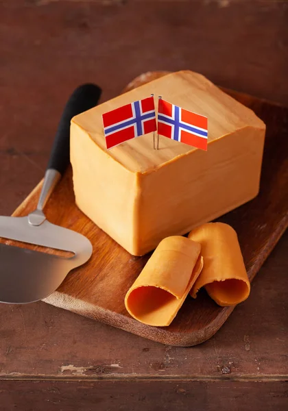 https://st2.depositphotos.com/1001944/50832/i/450/depositphotos_508324950-stock-photo-norwegian-brunost-traditional-brown-cheese.jpg