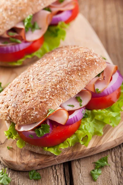 Sandwich with ham tomato and lettuce — Stock Photo, Image