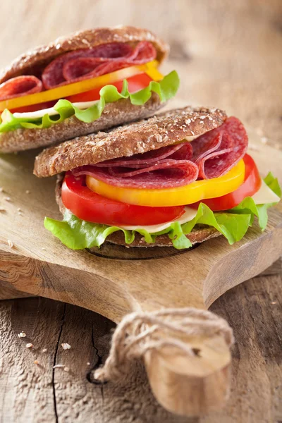 Healthy sandwich with salami tomato pepper and lettuce — Stock Photo, Image