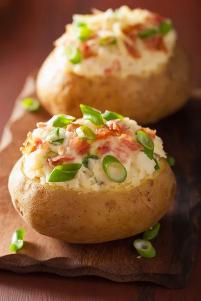 Baked potato in jacket with bacon and cheese — Stock Photo, Image