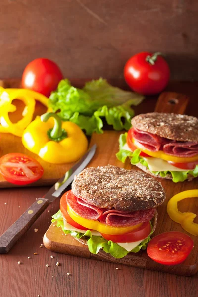 Healthy sandwich with salami tomato pepper and lettuce — Stock Photo, Image