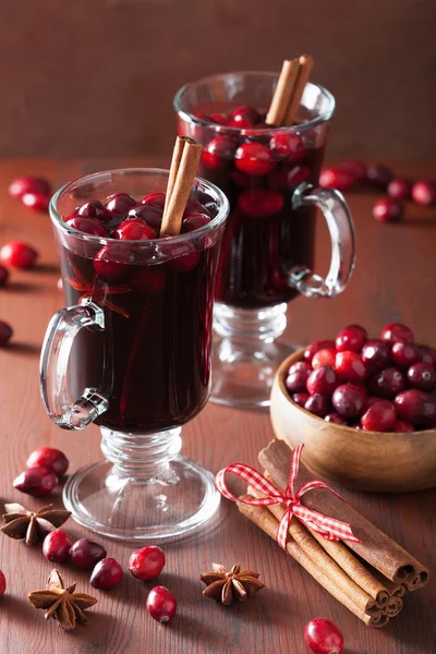 Glass of mulled wine with cranberry and spices, winter drink — Stock Photo, Image