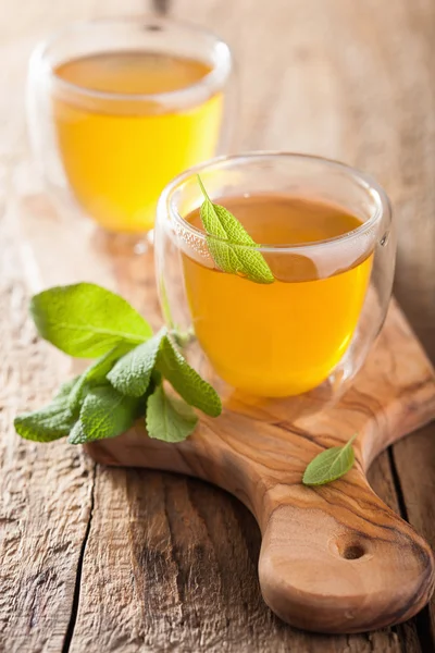 Herbal sage tea with green leaves in glass cups — Stock Photo, Image