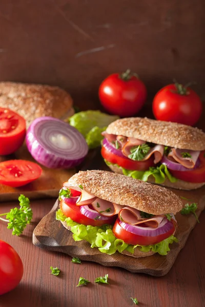 Healthy sandwich with ham tomato and lettuce — Stock Photo, Image