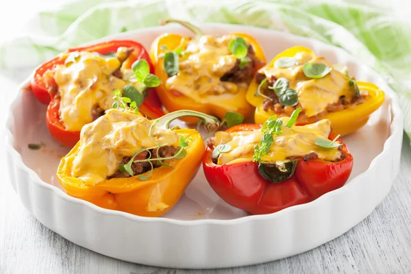 Stuffed colorful peppers with meat cheese vegetables — Stock Photo, Image