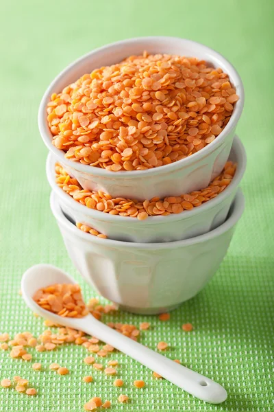 Raw healthy red lentils in bowls — Stock Photo, Image