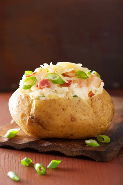 Baked potato in jacket with bacon and cheese — Stock Photo, Image