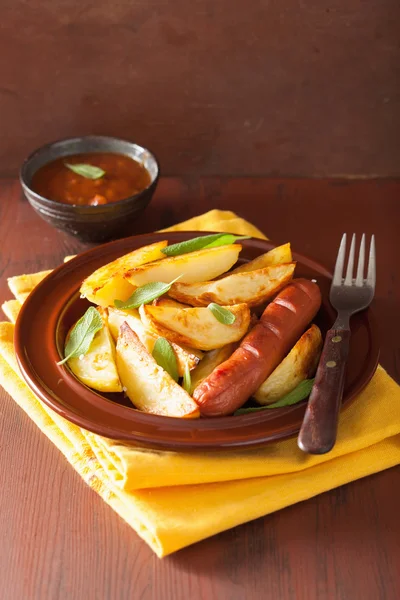 Baked potato wedges in plate over brown rustic table — Stock Photo, Image