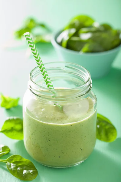 Healthy green smoothie with spinach mango banana in glass jars — Stock Photo, Image