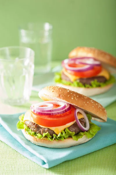 Burger with beef patty cheese lettuce onion tomato — Stock Photo, Image