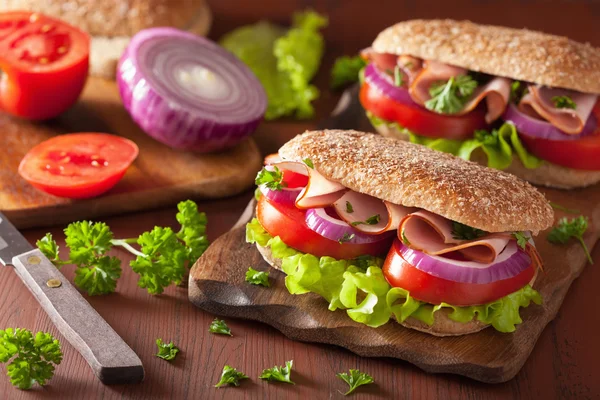 Sandwich with ham tomato and lettuce — Stock Photo, Image
