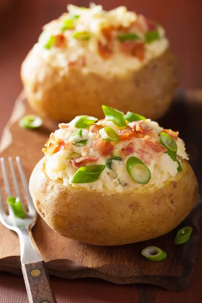 Baked potato in jacket with bacon and cheese — Stock Photo, Image
