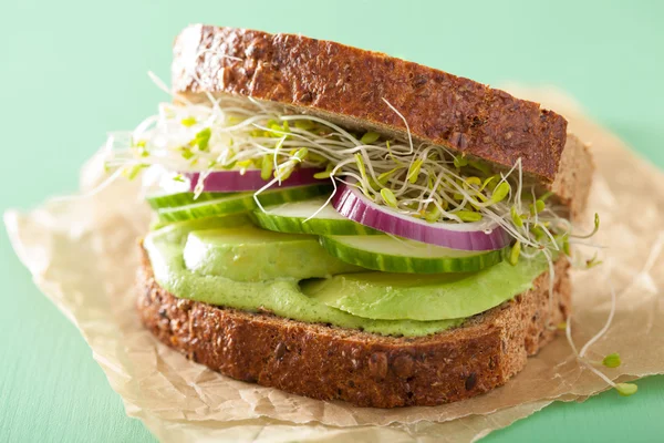 Healthy rye sandwich with avocado cucumber alfalfa sprouts — Stock Photo, Image