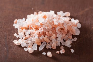 pink rose petals over dark rustic background