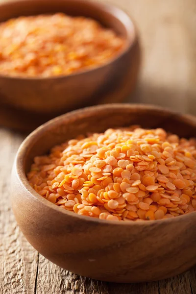 Raw healthy red lentils in bowls — Stock Photo, Image