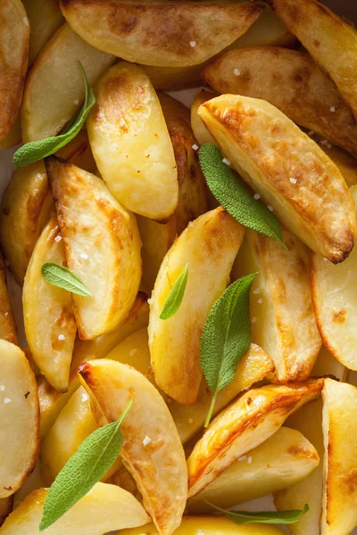 Baked potato wedges background — Stock Photo, Image