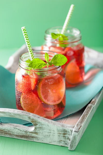 summer strawberry lemonade with lime and mint in jars