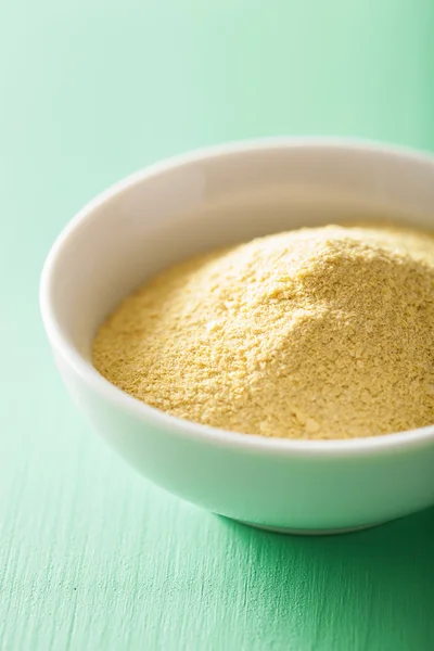 Vegan nutritional yeast flakes in bowl — Stock Photo, Image