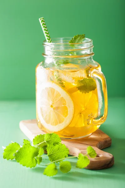 Ice tea with lemon and melissa in mason jar — Stock Photo, Image