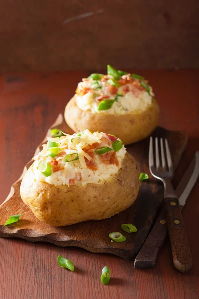 Baked potato in jacket with bacon and cheese — Stock Photo, Image