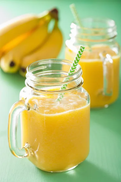 Healthy yellow smoothie with mango pineapple banana in mason jar — Stock Photo, Image