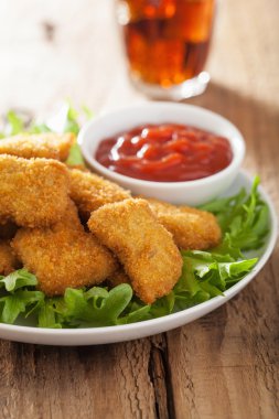 fast food chicken nuggets with ketchup, cola