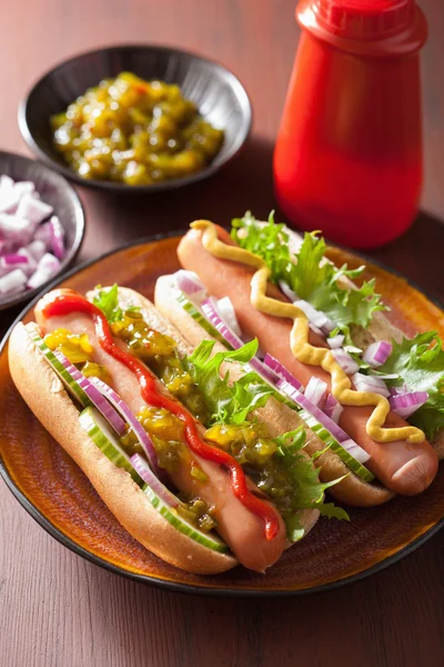 Grilled hot dogs with vegetables ketchup mustard — Stock Photo, Image