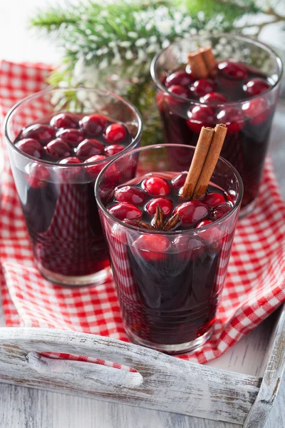 Glass of mulled wine with cranberry and spices, winter drink — Stock Photo, Image