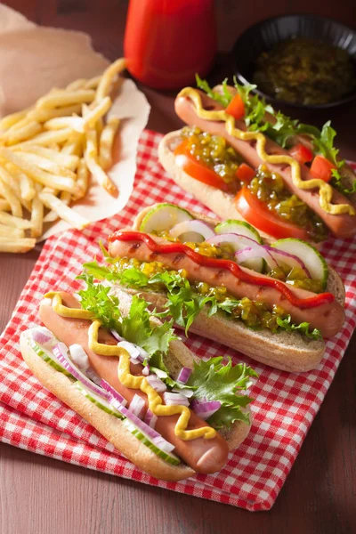 Grilled hot dogs with vegetables ketchup mustard — Stock Photo, Image